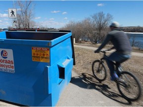 SASKATOON, SK -  A Loraas Disposal bin sits near the weir on Earth Day, the start of a month-long campaign by Meewasin Valley Authority to clean-up the riverbank area. People are encouraged to cleanup the river area and use the bins provided in Saskatoon, Sask., on April 22, 2018.