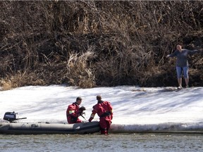 The Saskatoon Firefighter water rescue team responds to a dog in the South Saskatchewan river near the Sutherland dog park in Saskatoon, SK on Thursday, April 26, 2018.