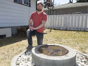 John Hickey, who started a petition against changes to the fire pit bylaw, stands for a photograph with his fire pit in his backyard in Saskatoon, SK on Thursday, April 26, 2018.