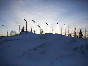 SASKATOON,SK--APRIL 12-9999-NEWS- Humboldt Broncos- Hockey sticks are seen stuck in the snow as a memorial to the Humboldt Broncos in Saskatoon, SK on Thursday, April 12, 2018.
