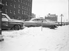 An image of snow on 20th Street East, from April 12, 1954. (Provincial Archives of Saskatchewan StarPhoenix Collection S-SP-B2479-1)