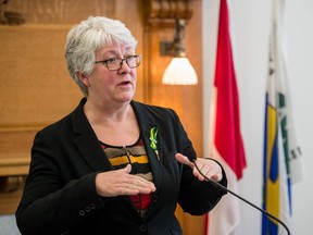 Saskatchewan New Democratic Party MLA and finance critic Cathy Sproule addresses members of the media regarding the 2018-2019 provincial budget at the legislative building in Regina.
