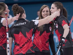 Canada's Emma Miskew, Joanne Courtney, skip Rachel Homan and Lisa Weagle, left to right, celebrate their victory over Switzerland in preliminary round in women's curling at the Pyeongchang 2018 Olympic Winter Games in Gangneung, South Korea, on February 18, 2018.