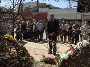 Saskatchewan's Minister of Labour Relations and Workplace Safety Don Morgan places a wreath during the National Day of Mourning to honour the 27 workers who died on the job in Saskatchewan during 2017 in Saskatoon on April 28, 2018. (Erin Petrow/ Saskatoon StarPhoenix)