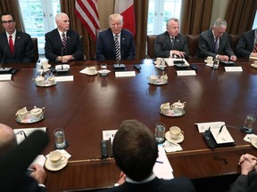 President Donald Trump and French President Emmanuel Macron during their meeting in the Cabinet Room of the White House in Washington, Tuesday, April 24, 2018.