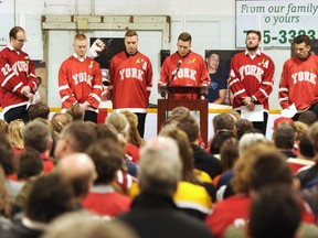 Members of the York Lions speak at the funeral for Humboldt Broncos assistant coach Mark Cross in Strasbourg, Sask. on Saturday, April 21, 2018.