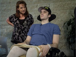 Humboldt Broncos hockey player Ryan Straschnitzki, who was paralyzed following a bus crash that killed 16 people, speaks to the media as his mother Michelle, looks on in Calgary, Alta., Wednesday, April 25, 2018.THE CANADIAN PRESS/Jeff McIntosh ORG XMIT: JMC110