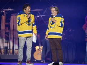 American comedians Terry Ree, left, and Bruce Williams, right, known as "The Indian and the White Guy," perform during the Country Thunder Humboldt Broncos Tribute Concert in Saskatoon, Sask. Friday, April 27, 2018.