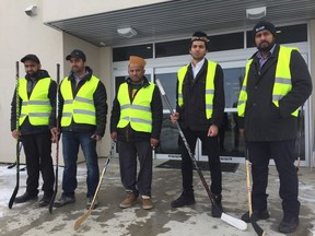 Members of the Baitur Reheat Mosque in Saskatoon hold hockey sticks in honour of the victims of the Humboldt Broncos bus crash on Friday, April 13, 2018. A large gathering from Saskatoon and area, including faith leaders, gathered at the mosque to offer special prayers for the Humboldt victims, their families and their friends. Jeff Losie/Saskatoon StarPhoenix