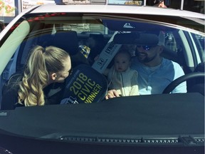 Lyndon, wife Shayleen and baby daughter Maisey of Saskatoon check out their new 2018 Honda Civic Sedan EX-T which was won by Lyndon in Tim Horton's Roll up the Rim contest in February. The family were presented with their brand new vehicle on April 23, 2018 at the Tim Horton's in Stonebridge. Jeff Losie/Saskatoon StarPhoenix