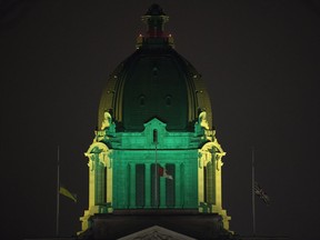 The dome of the Legislative Building is illuminated in green and yellow on April 11, 2018, to remember the 16 people killed on the Humboldt Broncos junior hockey team bus when it crashed on April 6, 2018.