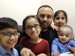 Muhammad Umar (centre) with his four children. Umar was stabbed on April 13, 2018, while working at his job driving a taxi for Regina Cabs.