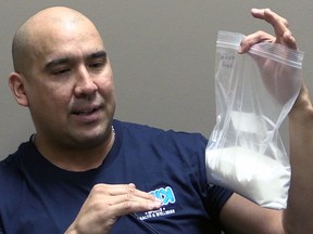 Carlin Nordstrom holds up a bag of sugar which is the equivalent sugar found in two small bottles of pop per day over one week. Nordstrom, the owner of Kisik Sports, Health and Wellness who gives motivational talks in Indigenous schools in Saskatchewan and Alberta, wants Indigenous communities to ban pop from their schools. Jeff Losie/Saskatoon StarPhoenix