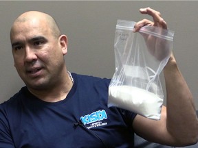 Carlin Nordstrom holds up a bag of sugar which is the equivalent sugar found in two small bottles of pop per day over one week. Nordstrom, the owner of Kisik Sports, Health and Wellness who gives motivational talks in Indigenous schools in Saskatchewan and Alberta, wants Indigenous communities to ban pop from their schools. Jeff Losie/Saskatoon StarPhoenix