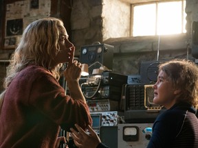 This image released by Paramount Pictures shows Emily Blunt, left, and Millicent Simmonds in a scene from "A Quiet Place."