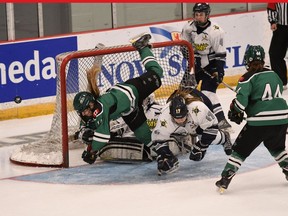 The Saskatoon Stars' MacKenna Parker is up-ended while driving to the net during Thursday's 5-2 Esso Cup victory over the North Selects from Nova Scotia.