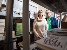 Heather Nickel, left, and Deana Driver, book publishers, stand in Nickel's book storage room in her Regina home. Driver and Nickel are among a number of Saskatchewan publishers upset about changes in publishing grants announced earlier this week by Creative Saskatchewan.