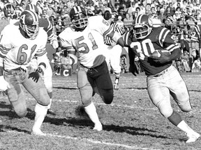 Robert Holmes, 30, is shown with the Saskatchewan Roughriders on Oct. 10, 1976 against the Toronto Argonauts. Making his first CFL start, Holmes rushed for 101 yards to help Saskatchewan win 34-3.