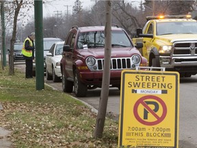 SASKATOON, SASK.; OCTOBER 24, 2016 - 1027 news sweeping  A Saskatoon towing company working along with the Saskatoon's parking enforcement were ticketing and making a clean sweep of vehicle off of 8th St. W., with the street sweepers on their way, October 24, 2016