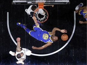 Golden State Warriors' Kevin Durant (35) is thrown back attempting to score against San Antonio Spurs' Pau Gasol, top, and forward LaMarcus Aldridge, bottom, during the second half of Game 3 of a first-round NBA basketball playoff series in San Antonio, Thursday, April 19, 2018.