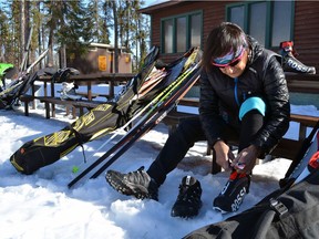 Four-time Olympian Sharon Firth puts on her skis at Don Allen trails, north of La Ronge, SK on Tuesday, April 18, 2018.