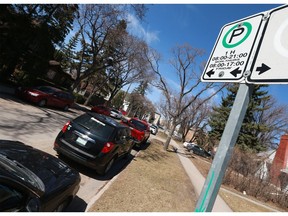 Cars are parked along Bottomley Avenue, near the University of Saskatchewan, in Saskatoon, Sask. on May 1, 2018. The city of Saskatoon is going to explore changing the rules around how long people can park a car on the streets. Right now, a car is only allowed to be there for 36 hours before risking a ticket.