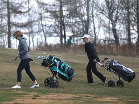 Donna Medernach (left) and Lucille Buettner enjoy their first game of golf of the season at Wildwood Golf Course in Saskatoon, Sask. on May 2, 2018.
