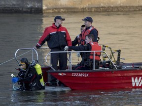 Saskatoon Firefighter Water Recuse team recovers a body from the South Saskatchewan River near the Broadway Bridge in Saskatoon, SK on Thursday, May 3, 2018.