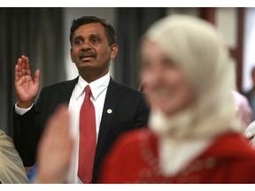 Abdul Manan recites the oath of citizenship during his Canadian citizenship ceremony at Park Town Hotel in Saskatoon, Sask. on May 8, 2018.