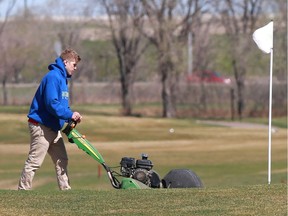 A green is being trimmed Wednesday, May 9, at the Saskatoon Golf & Country Club during what has been a late start to the golf season in Saskatoon.