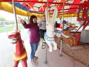 Vanessa Shannon celebrated Mother's Day with her 2-year-old son Austin Shannon on the merry-go-round at Kinsmen Park during its opening day in Saskatoon on May 14, 2017.