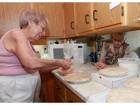 Pat Trask and June Quittenbaum make pies which are being sold with the proceeds going to STARS because of the Humboldt tragedy in Saskatoon, Sask. on May 29, 2018.