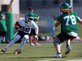 Saskatchewan Roughriders receiver Shaq Evans (86) runs a drill on linebacker/safety Cody Peters during a training camp session at Griffiths Stadium in Saskatoon on May 29, 2018.