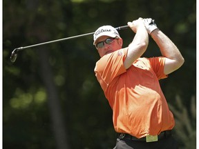 Brad Fritsch, of Canada, watches his tee shot on the second hole during the third round of the Wyndham Championship golf tournament in Greensboro, N.C., Saturday, Aug. 16, 2014.