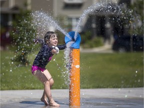Madeline Larson, age 4, enjoys the spray pad at the Stonebridge Spray Park in Saskatoon, Sask. on Friday, July 7, 2017.