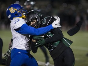 SASKATOON,SK--OCT 14 2017-1014-SPORTS-HUSKIESFOOTBALL- UBC's receiver Trivel Pinto goes to tackle Huskies DB Payton Hall during the game at Griffiths Stadium in Saskatoon, SK on Saturday, October 14, 2017.