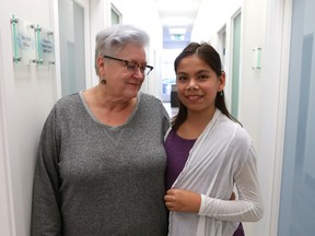 Fran Forsberg stands with her 13-year-old daughter, Skylar Forsberg. A Queen's Bench justice denied Forsberg's request to remove gender markers from government IDs.