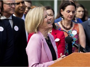 Surrounded by members of her NDP caucus, Alberta Premier Rachel Notley announces that the Government of Canada, with support from the Government of Alberta, has purchased the Trans Mountain Pipeline and associated assets, during a press conference outside the Alberta Legislature in Edmonton Tuesday May 29, 2018.