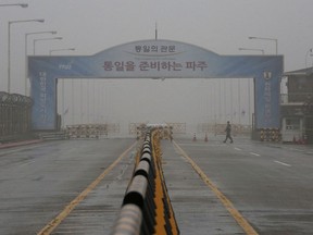 A South Korean army soldier walks on Unification Bridge, which leads to the demilitarized zone, near the border village of Panmunjom in Paju, South Korea, Wednesday, May 16, 2018. North Korea on Wednesday canceled a high-level meeting with South Korea and threatened to scrap a historic summit next month between U.S. President Donald Trump and North Korean leader Kim Jong Un over military exercises between Seoul and Washington that Pyongyang has long claimed are invasion rehearsals.