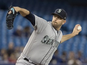 Seattle Mariners starting pitcher James Paxton throws against the Toronto Blue Jays in first inning American League MLB baseball action in Toronto on Tuesday May 8, 2018.