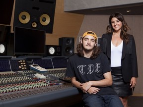 Deacon Frey, son of the late Eagles co-founder Glenn Frey, left, and his mother Cindy Frey pose for a portrait at Dog House Recording Studio in Los Angeles. Deacon Frey is keeping his dad's legacy alive by touring and performing with the Eagles.