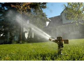 Watering grass. File. Photo by WAYNE CUDDINGTON, THE OTTAWA CITIZEN