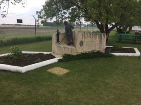 The Eaton Internment Camp Memorial Garden at the Saskatchewan Railway Museum was officially dedicated on Friday, May 25, with a ceremony that included a shrubbery planting of kalyna, or a high bush cranberry, and an elder tree beside the monument, pictured above.