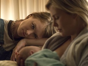 Mackenzie Davis (L) and Charlize Theron star in "Tully."