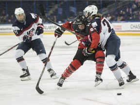 Canada's Jillian Saulnier battles with USA's Kacey Bellamy during the final of the 2017 4 Nations Cup.