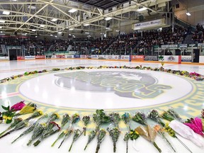 Flowers lie at centre ice during a Humboldt Broncos vigil last month.