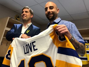 Saskatoon Blades' new head coach Mitch Love (right) stands with general manager Colin Priestner during a Wednesday news conference.