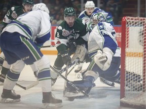 Patrick Bajkov of the Everett Silvertips looks for a loose puck in front of Swift Current Broncos goalie Stuart Skinner during Game 1 of the WHL final on Friday. Photo courtesy Robert Murray/WHL.