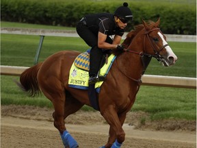 Kentucky Derby entrant Justify trains at Churchill Downs Thursday, May 3, 2018, in Louisville, Ky. The 144th running of the Kentucky Derby is scheduled for Saturday, May 5.