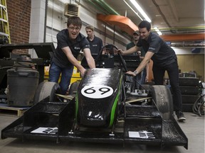Matthew Hill (L front), Mitchel Knaus (R front), Chad Lucyshyn (L back) and Carter Bohn(R back)  push their Formula Racing car out of the garage at the University of Saskatchewan in Saskatoon on Saturday, May 19, 2018.